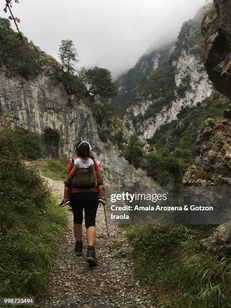 mother and daughter in route of las xanas gorge. asturias, spain. - ecological reserve stock pictures, royalty-free photos & images