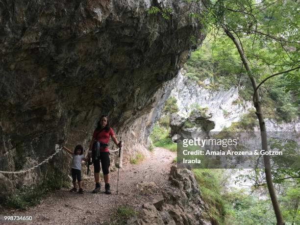mother and daughter in route of las xanas gorge. asturias, spain. - ökologisches reservat stock-fotos und bilder