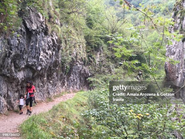 mother and daughter in route of las xanas gorge. asturias, spain. - ecological reserve stock pictures, royalty-free photos & images