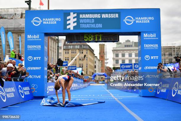 Cassandre Beaugrand of France celebrates of finishing first during the ITU World Triathlon Elite women sprint race on July 14, 2018 in Hamburg,...