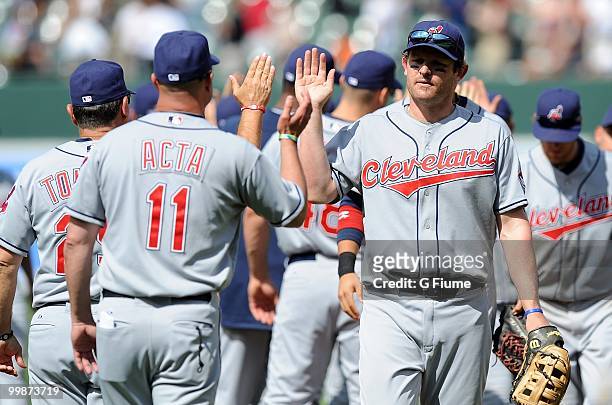 Austin Kearns of the Cleveland Indians celebrates with manager Manny Acta after a 5-1 victory against the Baltimore Orioles at Camden Yards on May...
