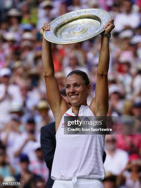 Poses with the trophy after winning the women's singles title on July 14, 2018 at the Wimbledon Championships, played at the AELTC in London, England.