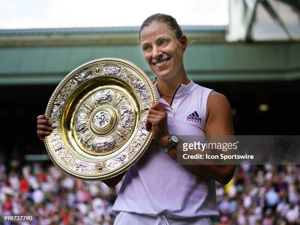 Poses with the trophy after winning the women's singles title on July 14, 2018 at the Wimbledon Championships, played at the AELTC in London, England.