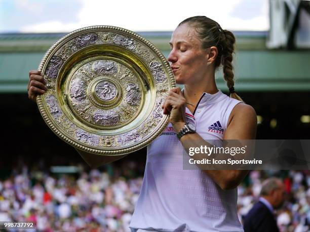 Poses with the trophy after winning the women's singles title on July 14, 2018 at the Wimbledon Championships, played at the AELTC in London, England.