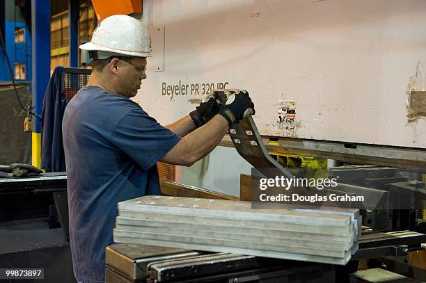 Worker makes parts for the Stryker Driver Enhancement Kits at JWF Defense Systems in Johnstown Pennsylvania. JWF Defense Systems is a small business...