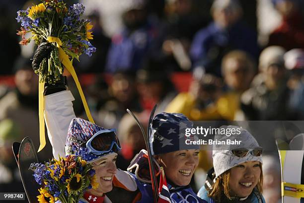 2nd place Shannon Bahrke of the USA, 1st place Kari Traa of Norway and 3rd place Tae Satoya of Japan during the flower ceremony for the women's...