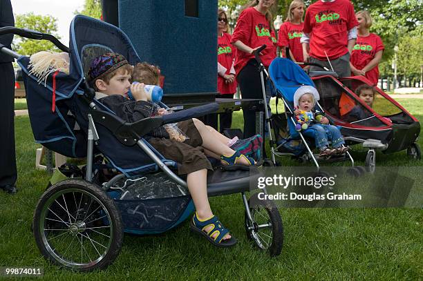 Ezra age 4, and his sister Eliana Reiter, age 2, of Washington, D.C. Attend a rally urging Congress to protect children from unsafe toys and other...