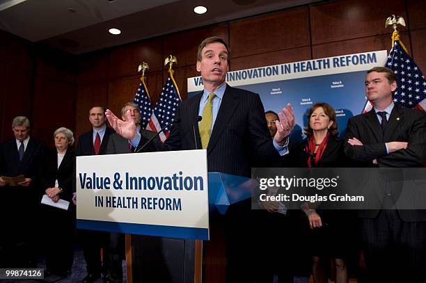 Mark Warner, D-VA., and eleven other freshmen senator during a press conference with the other freshman Democrats to introduce a package of...