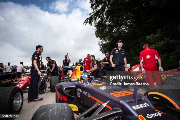 Patrick Friesacher of Austria prepares to drive the Red Bull Racing RB8 during the Goodwood Festival of Speed at Goodwood on July 13, 2018 in...