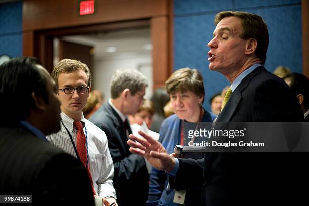 Mark Warner, D-VA., talks with reporters after a press conference with the eleven freshman Democrats to introduce a package of amendments that will...