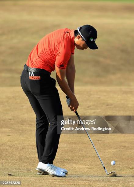 Haotong Li of China takes his second shot on hole eighteen during day three of the Aberdeen Standard Investments Scottish Open at Gullane Golf Course...