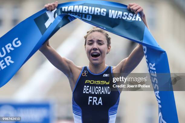 Cassandre Beaugrand of France celebrates after finishing first during the ITU World Triathlon Elite women sprint race on July 14, 2018 in Hamburg,...