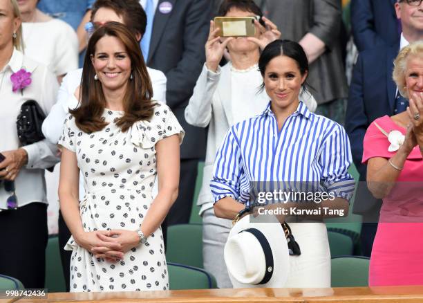 Catherine, Duchess of Cambridge and Meghan, Duchess of Sussex attend day twelve of the Wimbledon Tennis Championships at the All England Lawn Tennis...