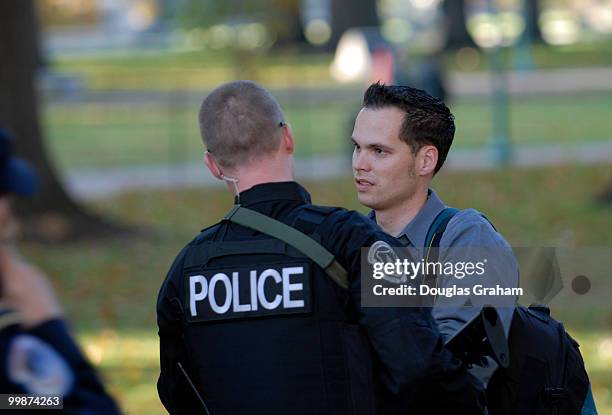 Staff photographer John Shinkle of the Capitol Leader is detained by U.S. Capitol Police after he left his bag unattended causing them to call in the...