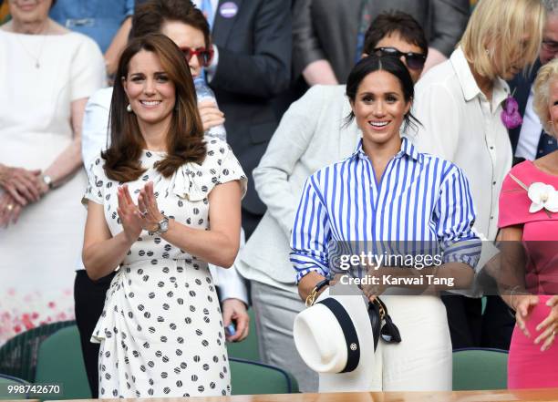 Catherine, Duchess of Cambridge and Meghan, Duchess of Sussex attend day twelve of the Wimbledon Tennis Championships at the All England Lawn Tennis...