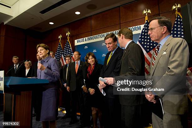 Mark Warner, D-VA., and eleven other freshmen senator during a press conference with the other freshman Democrats to introduce a package of...