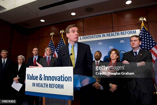 Mark Warner, D-VA., and eleven other freshmen senator during a press conference with the other freshman Democrats to introduce a package of...