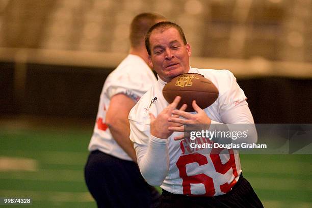 Capitol Hill Police warm up before the start of the Roll Call Longest Yard Football Classic charity football game being played at the D.C. Armory for...