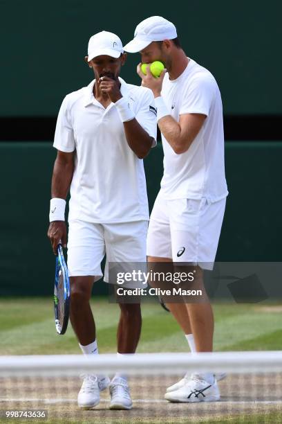 Raven Klaasen of South Africa and Michael Venus of New Zealand discuss tactics during the Men's Doubles final against Mike Bryan and Jack Sock of The...