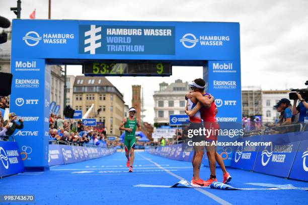 Vincent Luis of France cheers with Mario Mola of Spain after competing in the ITU World Triathlon Elite Men race on July 14, 2018 in Hamburg, Germany.