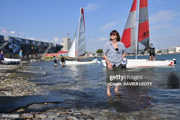 French actress and singer Jane Birkin poses for a picture with her dog named "Dolly", during the 34th edition of the Francofolies Music Festival in...