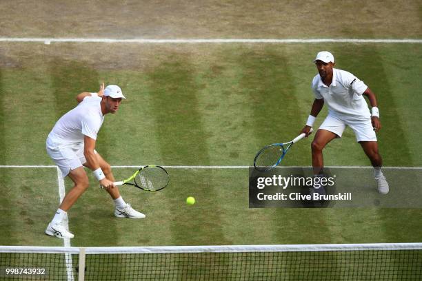 Raven Klaasen of South Africa and Michael Venus of New Zealand return against Mike Bryan and Jack Sock of The United States during the Men's Doubles...