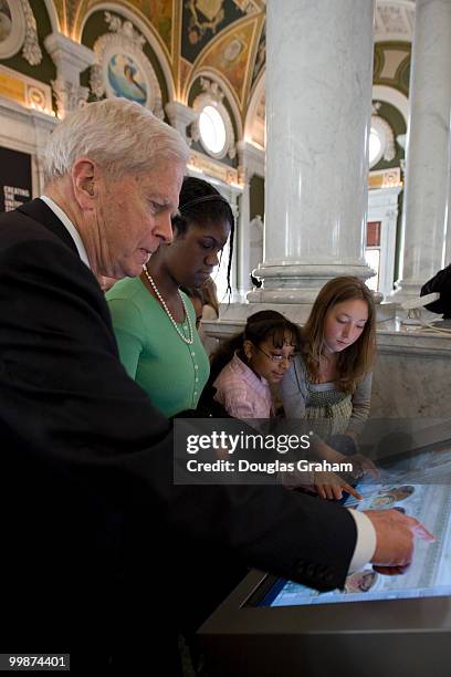 Librarian of Congress James H. Billington talks with school kids during a media preview of the new LOC Experience, which will feature interactive...