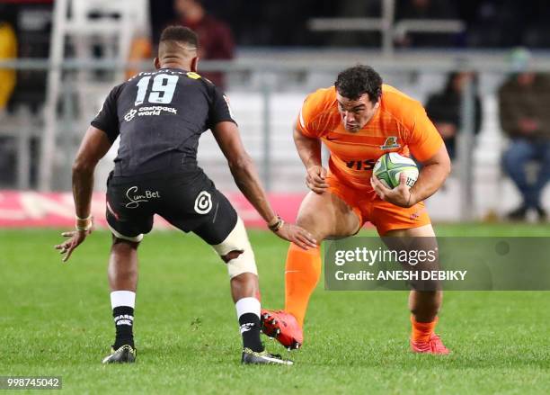 Jaguares' hooker Auustin Creevy runs into Sharks' lock Hyron Andrews during the Super Rugby match between the Sharks and the Jaguares at the Kings...