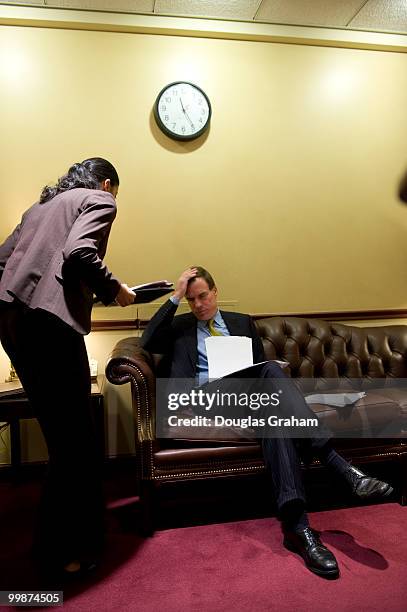 Mark Warner, D-VA., talks with Legislative Assistant Aryana Khalid before the start of press conference with the eleven freshman Democrats to...