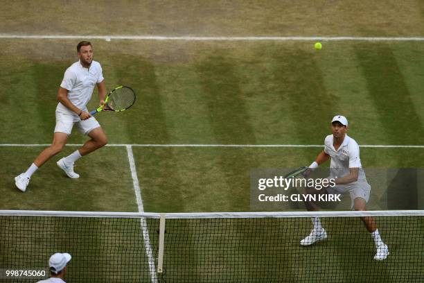 Player Mike Bryan and US player Jack Sock return to South Africa's Raven Klaasen and New Zealand's Michael Venus during their mens' doubles final...