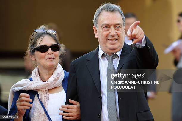 British director Stephen Frears and guest arrive for the screening of "Tamara Drewe" presented out of competition at the 63rd Cannes Film Festival on...