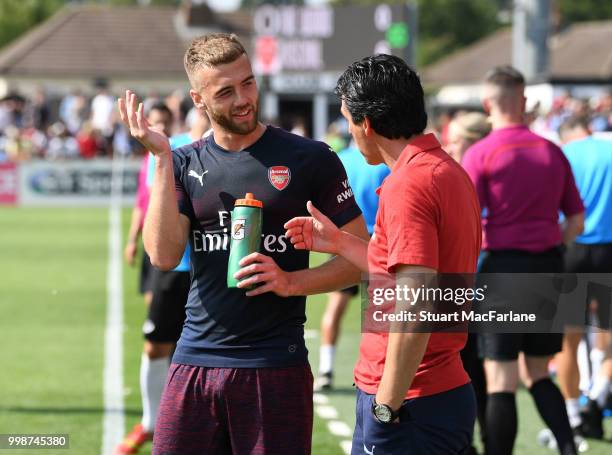 Arsenal Head Coach Unai Emery talks to Calum Chambers during the pre-season friendly between Boreham Wood and Arsenal at Meadow Park on July 14, 2018...