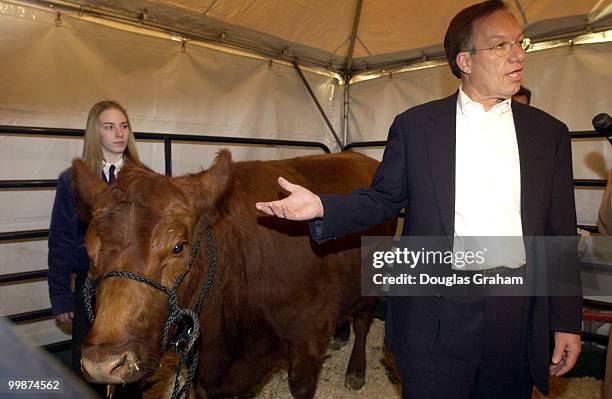 Wayne Allard, R-CO., explains biometrics at a press conference on the West Front of the U.S. Capitol. Retinal scanning of cows is a practical way to...