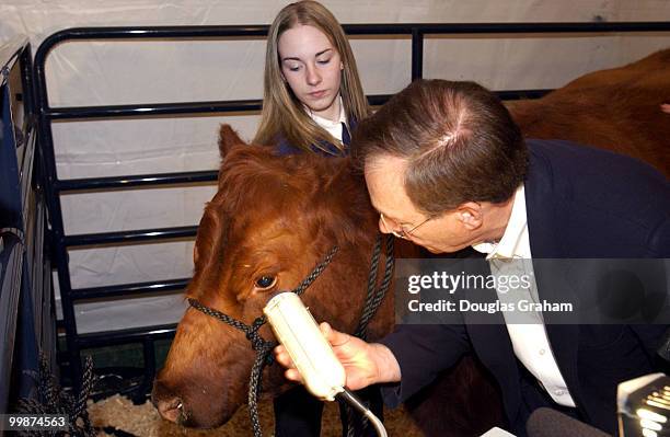 Wayne Allard, R-CO., explains biometrics at a press conference on the West Front of the U.S. Capitol. Retinal scanning of cows is a practical way to...