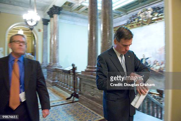 Mark R. Warner, D-VA and Communications Director Kevin Hall rush to a meeting in the U.S. Capitol. May 12, 2009.