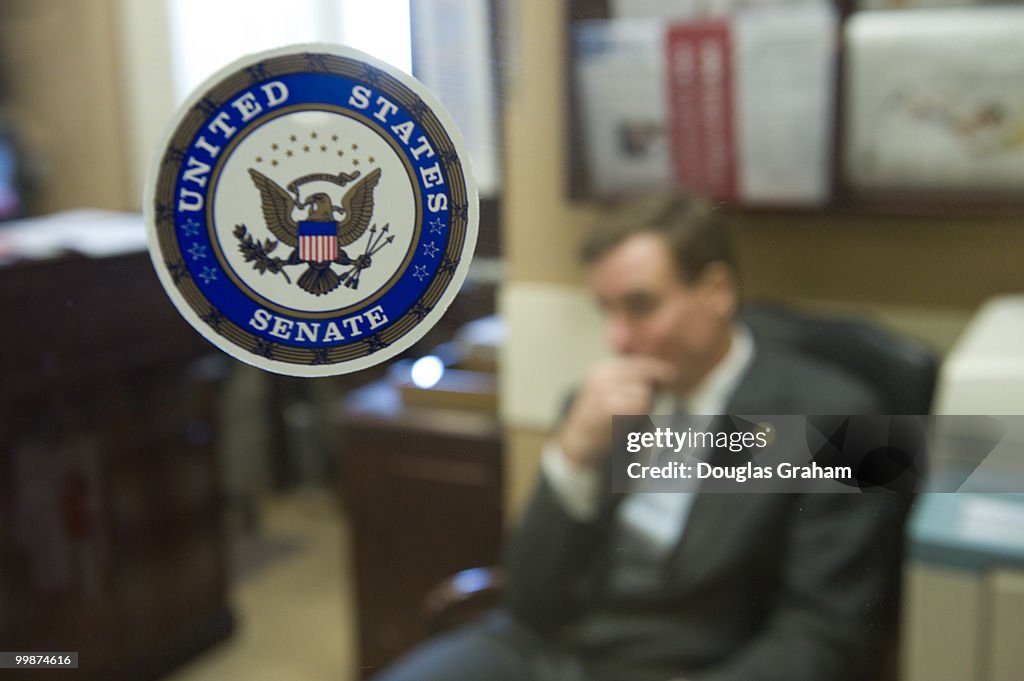 Mark R. Warner, D-VA waits for Charles Schumer, D-NY in the