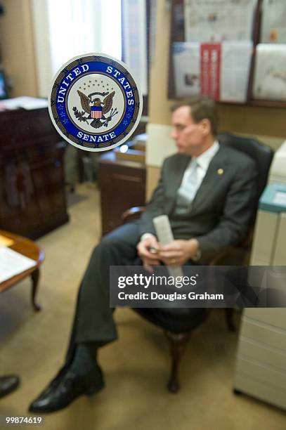 Mark R. Warner, D-VA waits for Charles Schumer, D-NY in the Senate Radio and TV gallery to announced that the Federal Trade Commission has...