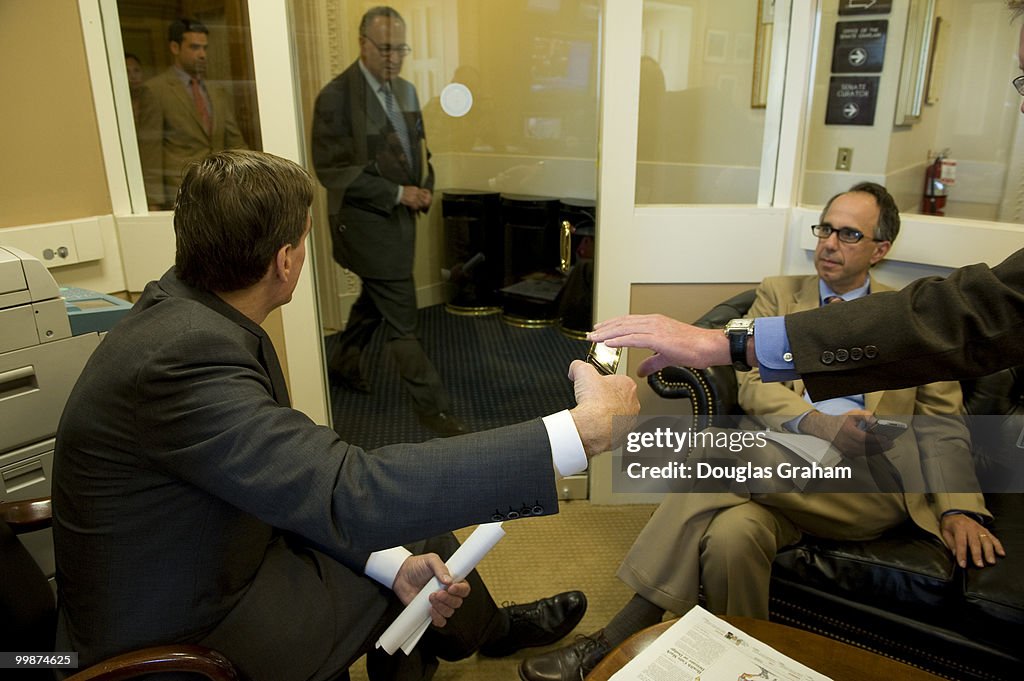 Mark R. Warner, D-VA waits with his Chief of Staff Luke Albe