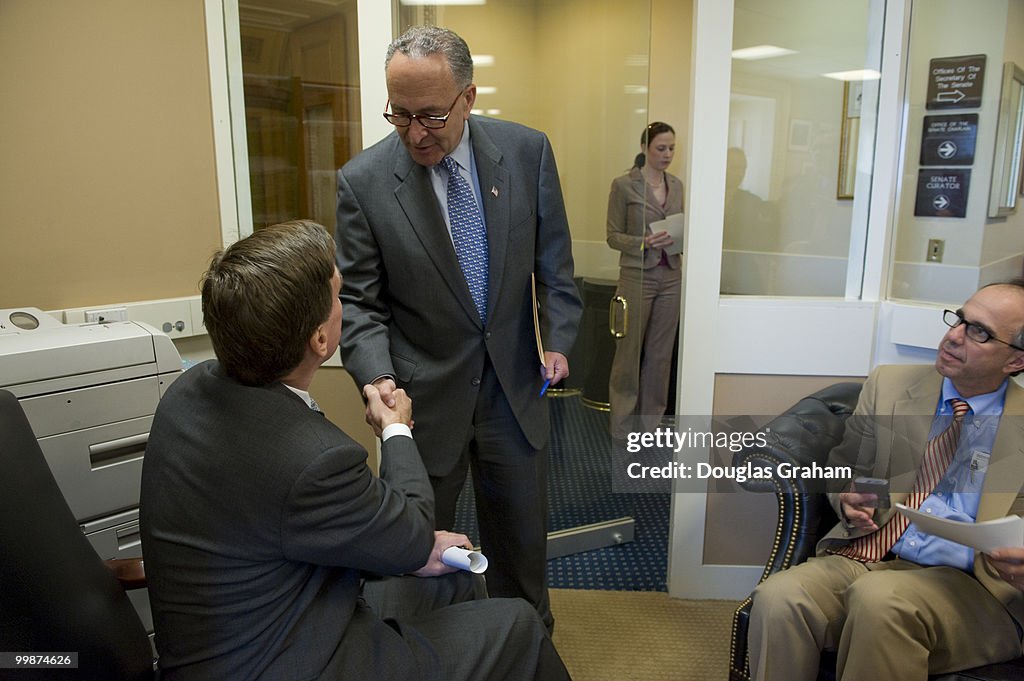 Mark R. Warner, D-VA greets Charles Schumer, D-NY in the Sen