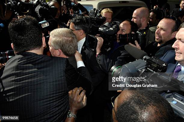 Bob Ney tries to get through the sea of photographers as he leaves the U.S. District Court October 13, 2006 in Washington, DC. Ney entered a guilty...