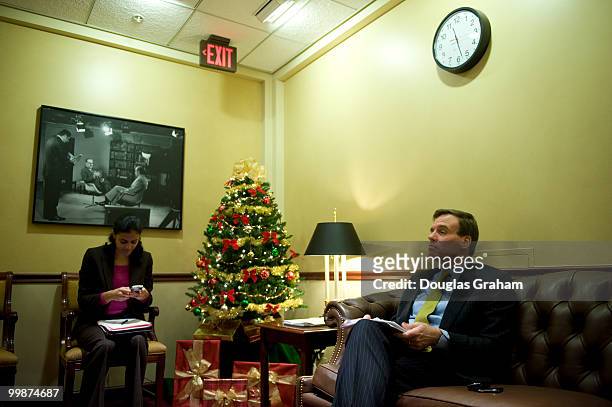 Mark Warner, D-VA., talks with Legislative Assistant Aryana Khalid before the start of press conference with the eleven freshman Democrats to...