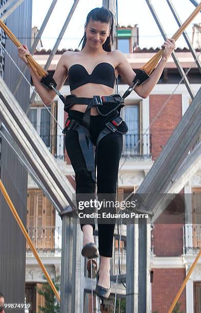 Model wearing the bra 'Perfect Strapless, designed by Wonderbra, jump on a trampoline to test the effectiveness of the new item of clothing at El...