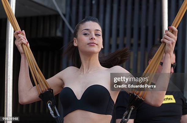 Model wearing the bra 'Perfect Strapless, designed by Wonderbra, jump on a trampoline to test the effectiveness of the new item of clothing at El...