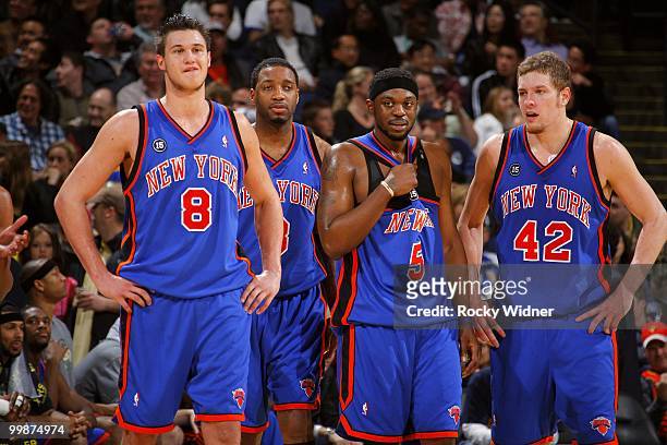 Danilo Gallinari, Tracy McGrady, Bill Walker and David Lee of the New York Knicks huddle on the court during the game against the Golden State...