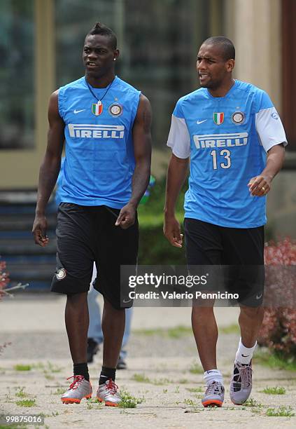 Mario Balotelli and Douglas Santos Maicon of FC Internazionale Milano attend an FC Internazionale Milano training session during a media open day on...