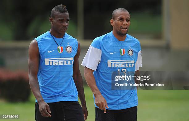 Mario Balotelli and Douglas Santos Maicon of FC Internazionale Milano attend an FC Internazionale Milano training session during a media open day on...