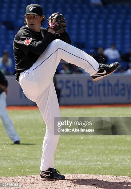 Scott Downs of the Toronto Blue Jays pitches against the Texas Rangers during a MLB game at the Rogers Centre on May 16, 2010 in Toronto, Ontario,...