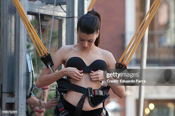 Model wearing the bra 'Perfect Strapless, designed by Wonderbra, jump on a trampoline to test the effectiveness of the new item of clothing at El...