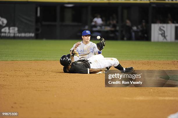 Juan Pierre of the Chicago White Sox steals second base as Chris Getz of the Kansas City Royals cannot catch the ball on May 03, 2010 at U.S....