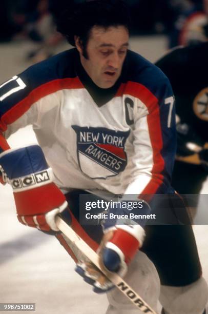 Phil Esposito of the New York Rangers skates on the ice with the puck during an NHL game against the Boston Bruins on March 18, 1978 at the Madison...